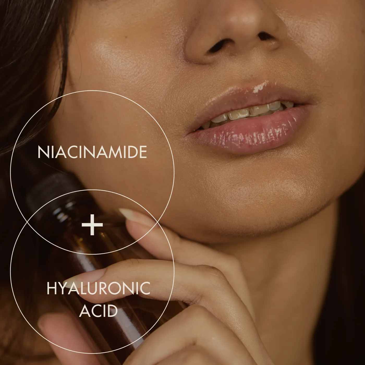 Niacinamide and hyaluronic acid serum held against the skin